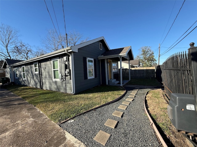 view of home's exterior with a lawn