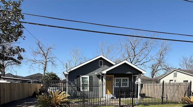 bungalow with a fenced front yard