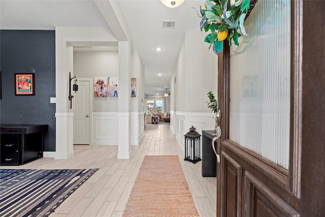 foyer featuring ceiling fan