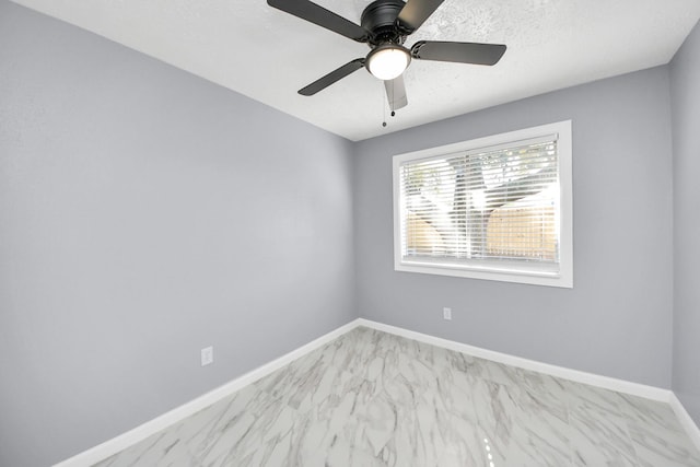 unfurnished room featuring ceiling fan