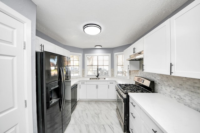 kitchen featuring sink, white cabinetry, tasteful backsplash, black appliances, and a textured ceiling