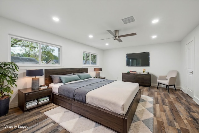 bedroom with dark wood-type flooring and ceiling fan