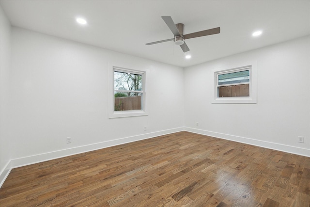 unfurnished room with dark wood-type flooring and ceiling fan