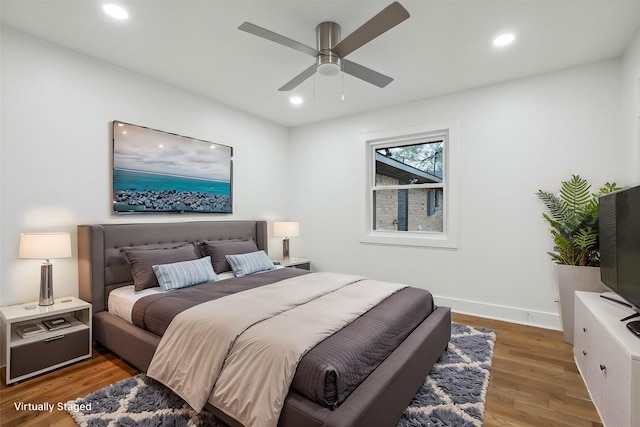 bedroom featuring dark wood-type flooring and ceiling fan