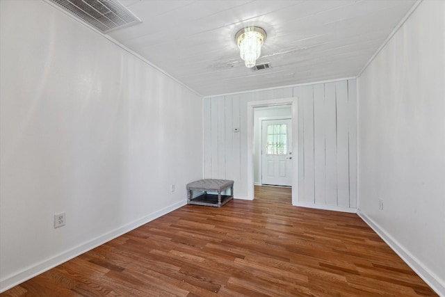 spare room with hardwood / wood-style floors