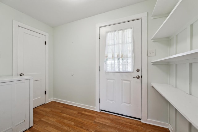 doorway to outside with wood-type flooring