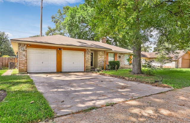 ranch-style home featuring a chimney, concrete driveway, an attached garage, fence, and cooling unit