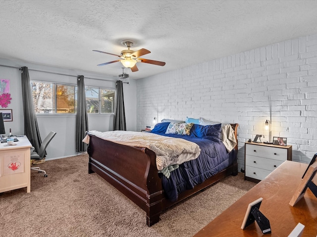 bedroom featuring brick wall, carpet floors, a textured ceiling, and ceiling fan