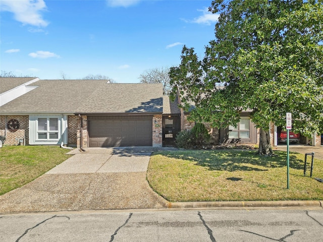 view of front of house with an attached garage, brick siding, driveway, roof with shingles, and a front yard