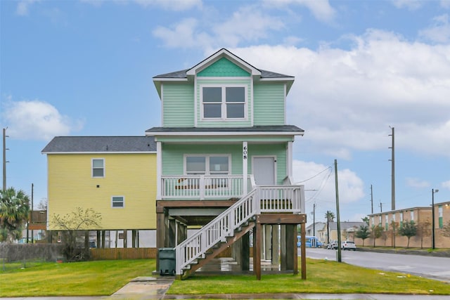 exterior space with a front yard and covered porch