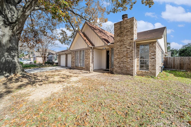 view of side of property featuring a garage