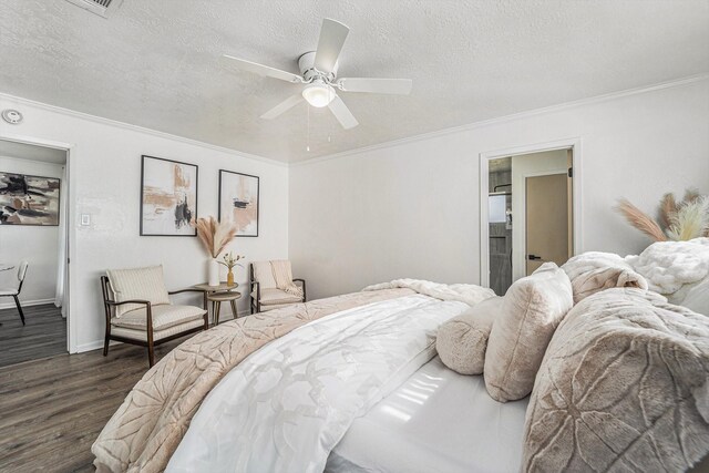 bedroom with crown molding, ceiling fan, dark hardwood / wood-style floors, ensuite bathroom, and a textured ceiling