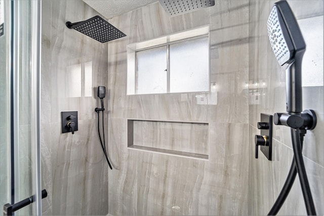 interior details featuring tiled shower