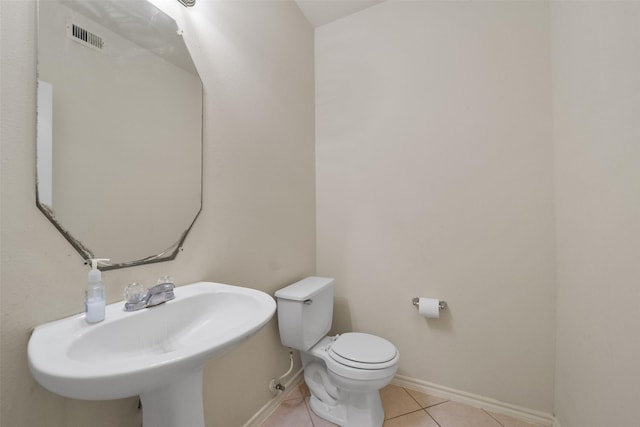 bathroom featuring tile patterned flooring, sink, and toilet