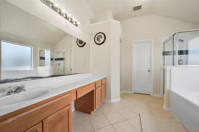 bathroom with tile patterned floors, separate shower and tub, vaulted ceiling, and vanity