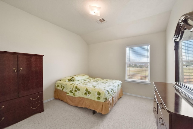 carpeted bedroom featuring vaulted ceiling