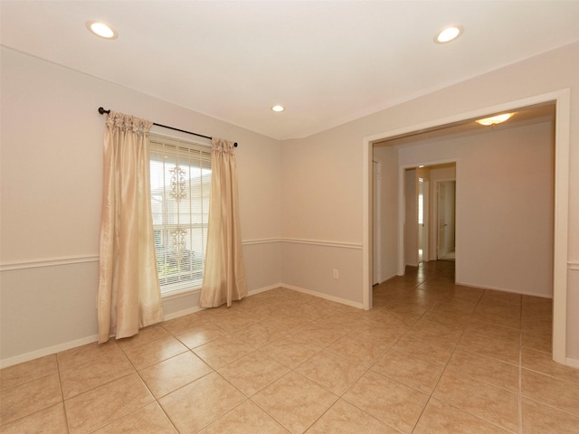 empty room with light tile patterned floors