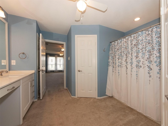 bathroom with vanity, a shower with curtain, and ceiling fan