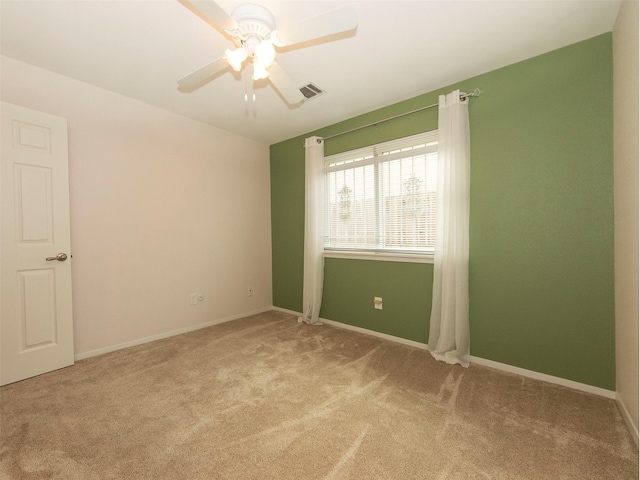 carpeted empty room with ceiling fan