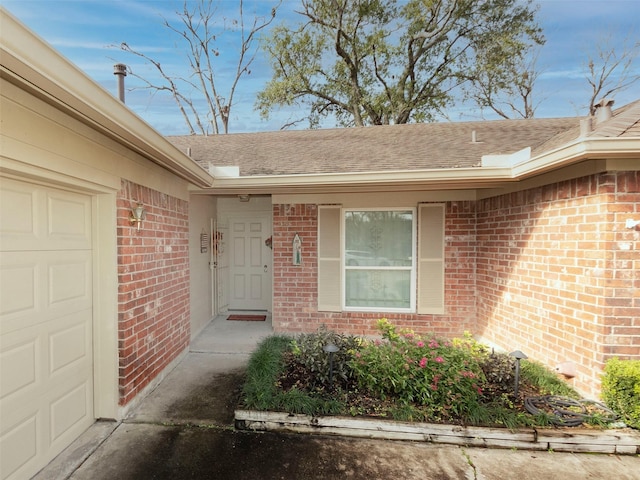 view of exterior entry featuring a garage