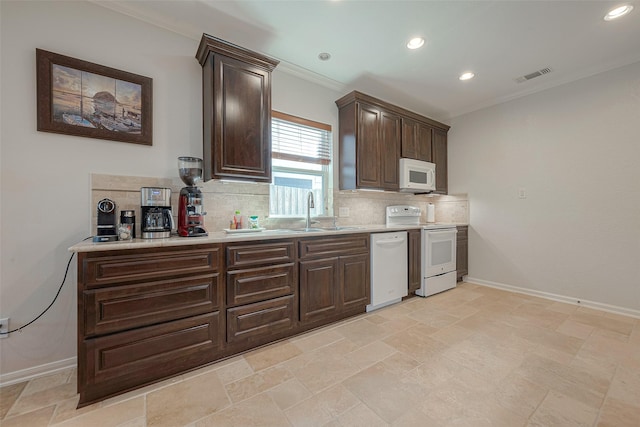 kitchen featuring tasteful backsplash, sink, crown molding, dark brown cabinets, and white appliances