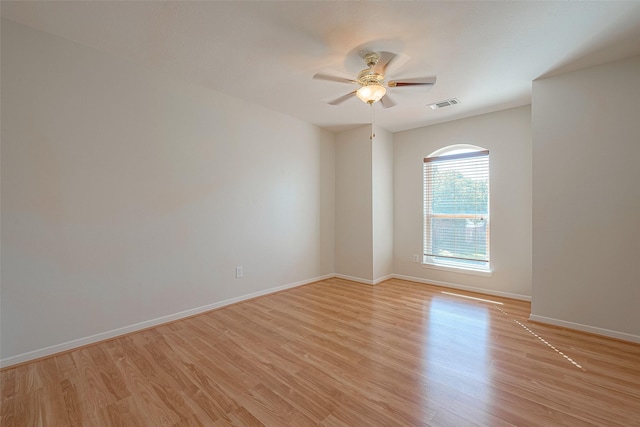 empty room featuring light hardwood / wood-style flooring and ceiling fan