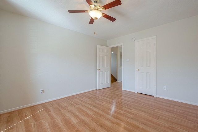 spare room with light hardwood / wood-style flooring and ceiling fan