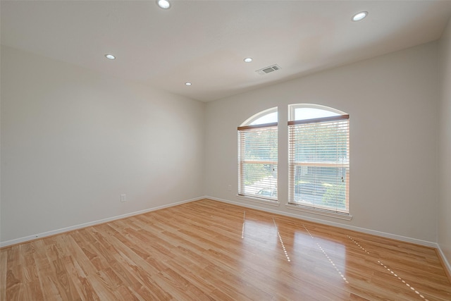 spare room with light hardwood / wood-style floors