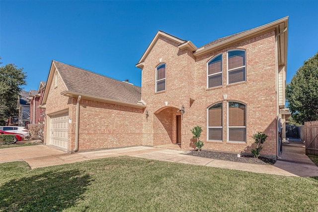 view of front of home featuring a garage and a front yard