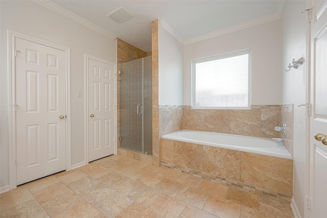 bathroom featuring ornamental molding and independent shower and bath