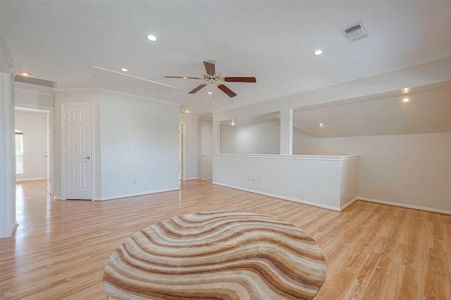 unfurnished room with ornamental molding, ceiling fan, and light wood-type flooring