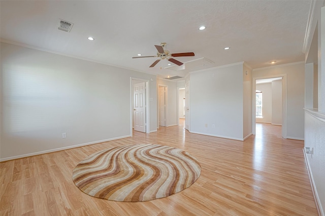 unfurnished room with crown molding and light hardwood / wood-style flooring