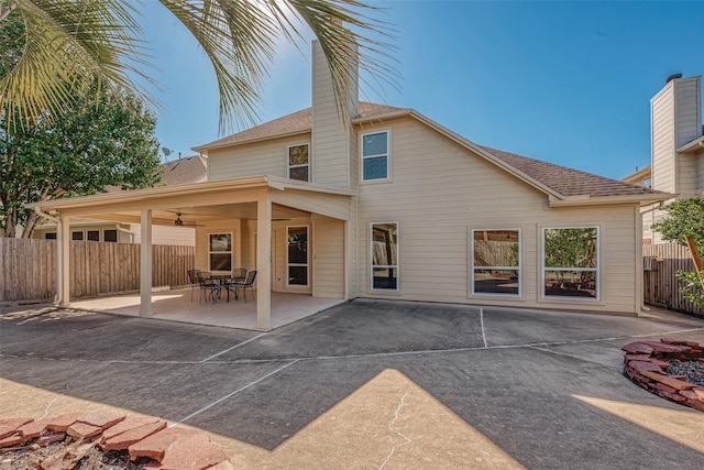 rear view of house featuring a patio and ceiling fan