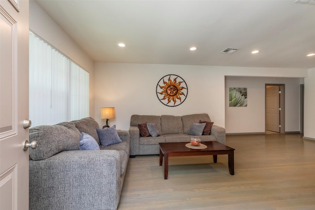 living room with light hardwood / wood-style floors