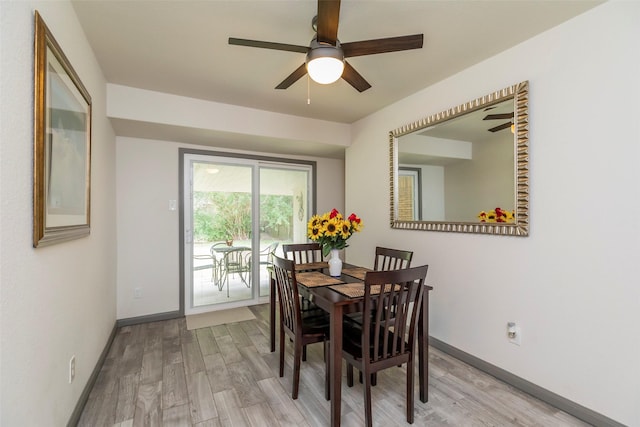 dining space with light hardwood / wood-style flooring