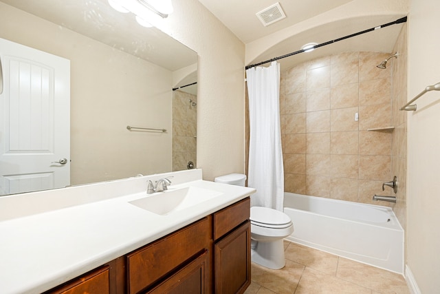 full bathroom with vanity, shower / bath combination with curtain, tile patterned floors, and toilet