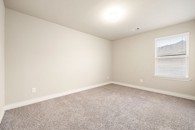 unfurnished room with carpet floors