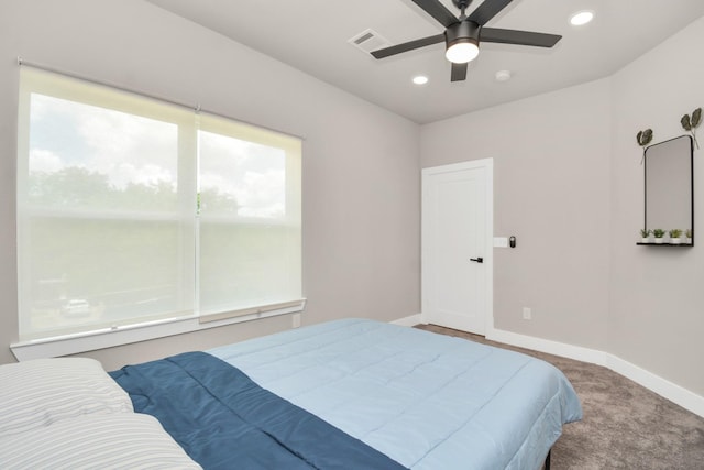 bedroom with multiple windows, carpet flooring, and ceiling fan