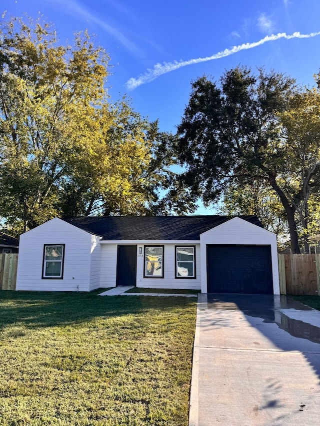 ranch-style house with a garage and a front yard