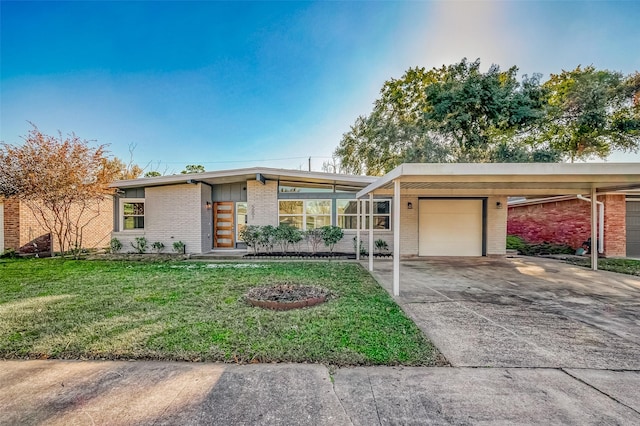 view of front of home with a garage, a carport, and a front yard