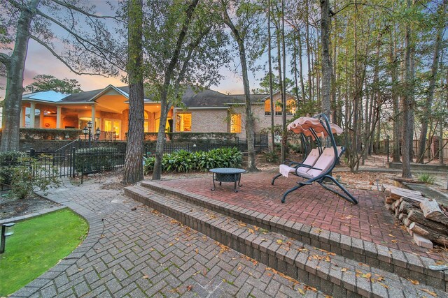 view of patio terrace at dusk