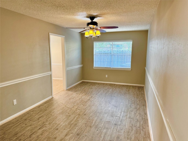 unfurnished room featuring ceiling fan, a textured ceiling, and light hardwood / wood-style floors