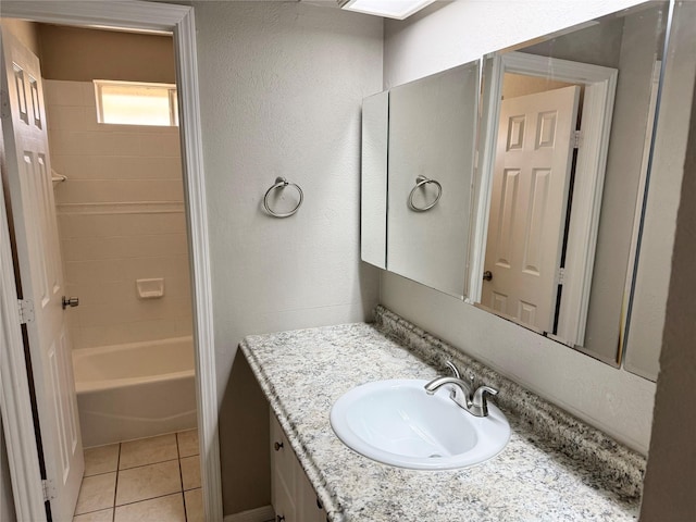 bathroom with tile patterned flooring, vanity, and  shower combination