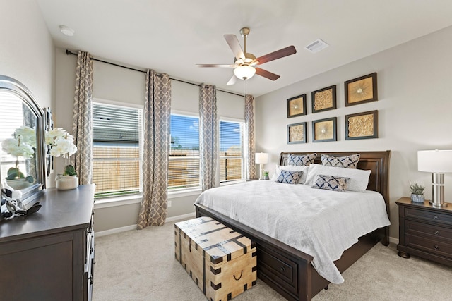 bedroom with light colored carpet and ceiling fan