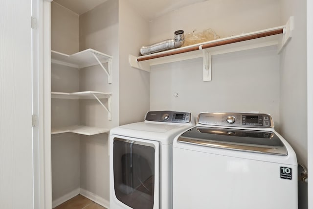 laundry area featuring tile patterned floors and independent washer and dryer