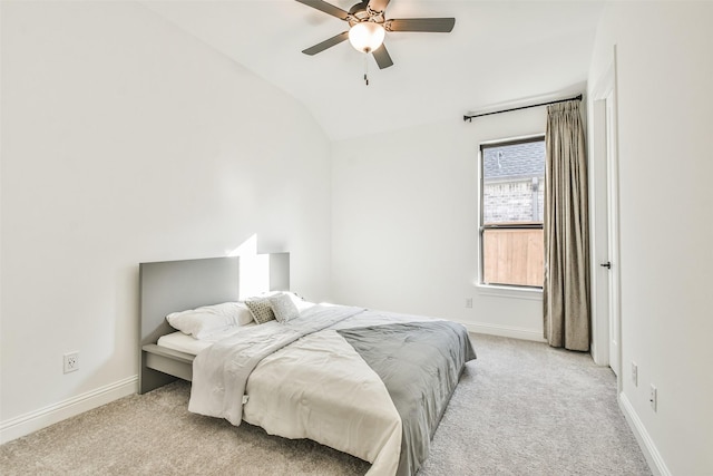 carpeted bedroom featuring ceiling fan and lofted ceiling