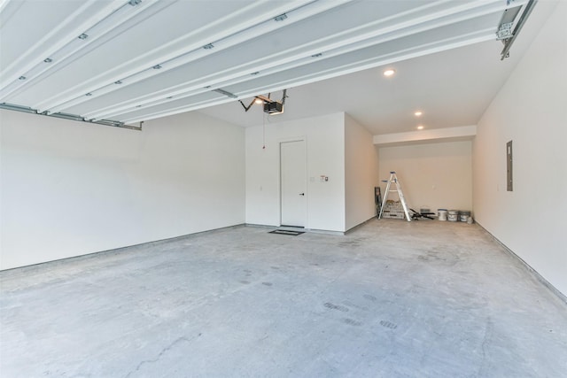 garage featuring a garage door opener and electric panel