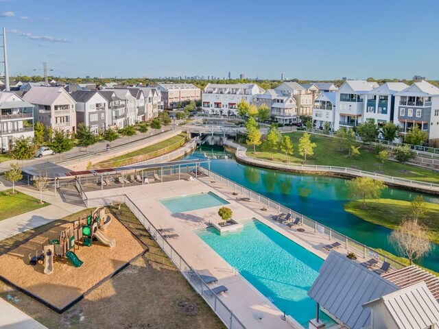 birds eye view of property featuring a water view