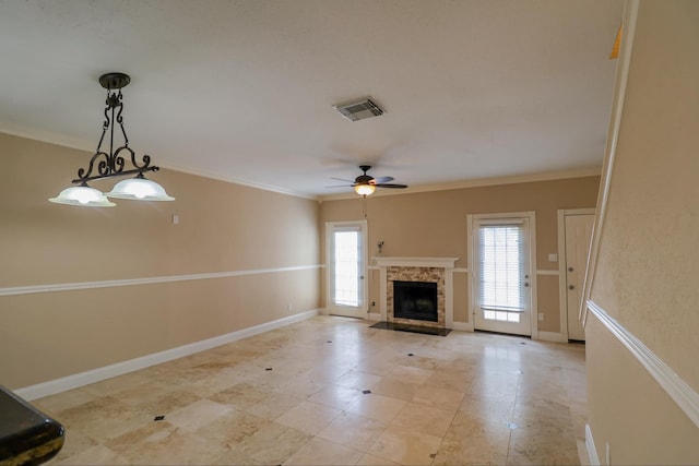 unfurnished living room with ornamental molding and ceiling fan