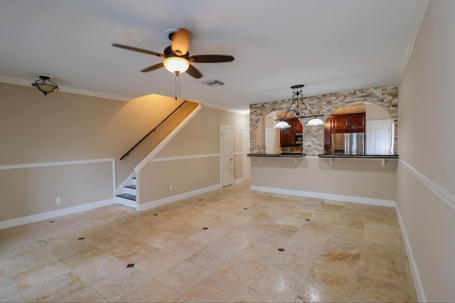 unfurnished living room featuring crown molding and ceiling fan